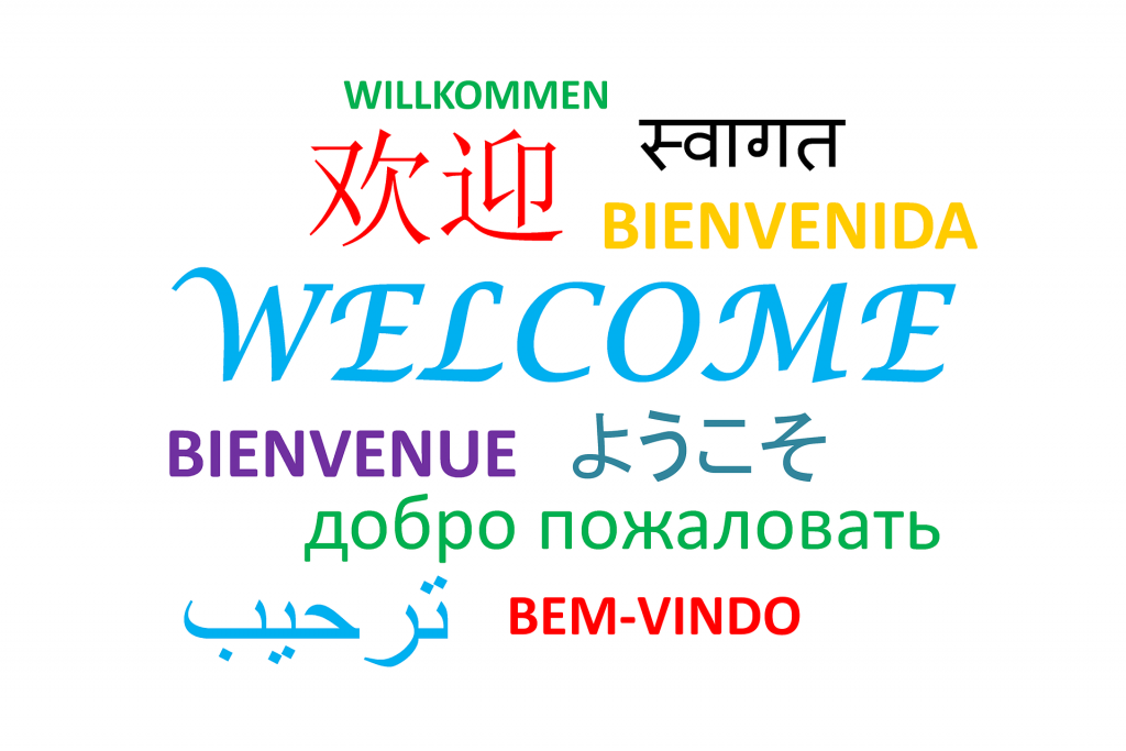 An image of the word Welcome written in different colors and in different languages. Get the feeling of traveling from home by learning another language!