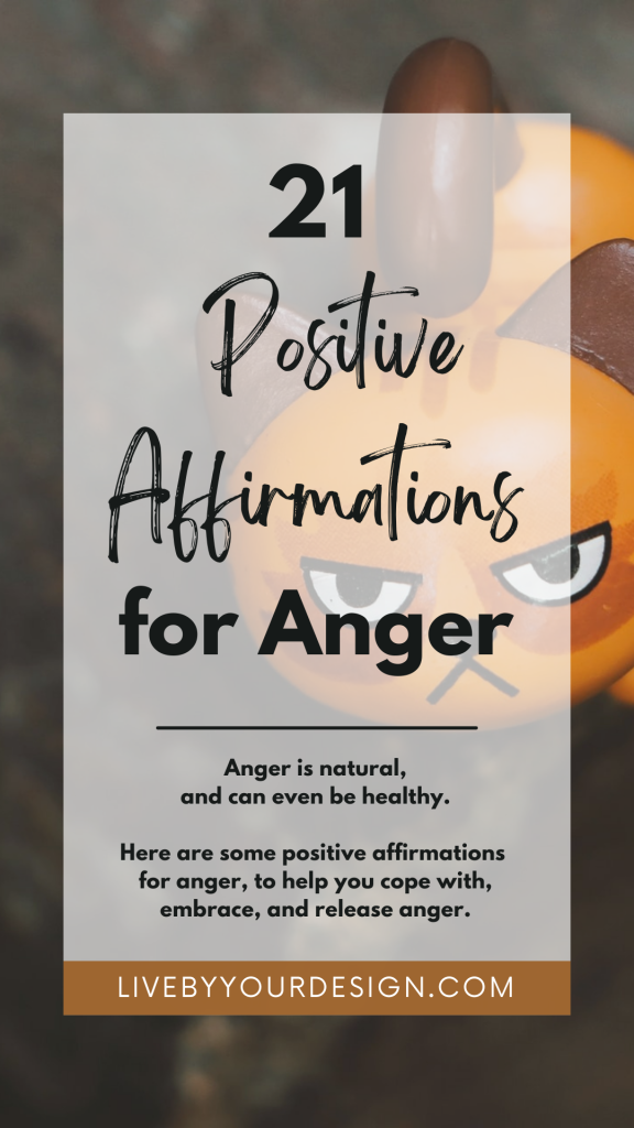 In the background, a close-up photo of a figurine of an angry looking orange cat. In the foreground, text reads: 21 positive affirmations for anger. Anger is natural, and can even be healthy. Here are some positive affirmations for anger, to help you cope with, embrace, and release anger. Below, highlighted in orange, is the URL to the blog, LiveByYourDesign.com.