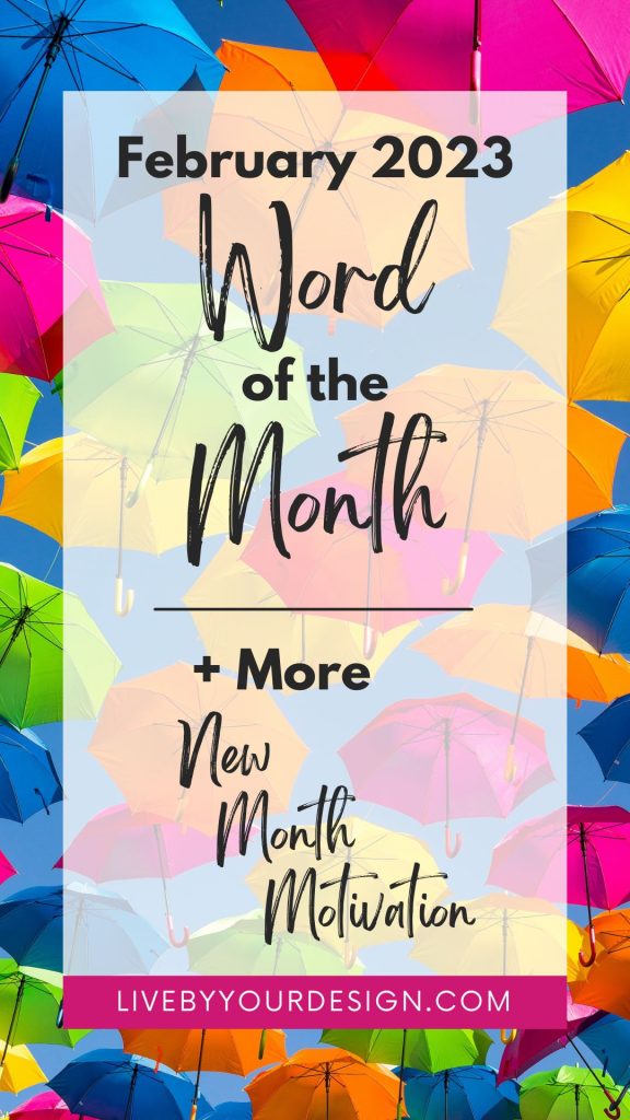 Colorful umbrellas in the background. In the foreground, text reads: February 2023 Word of the Month, plus more new month motivation. Below, highlighted in pink, is the URL to the blog, LiveByYourDesign.com.